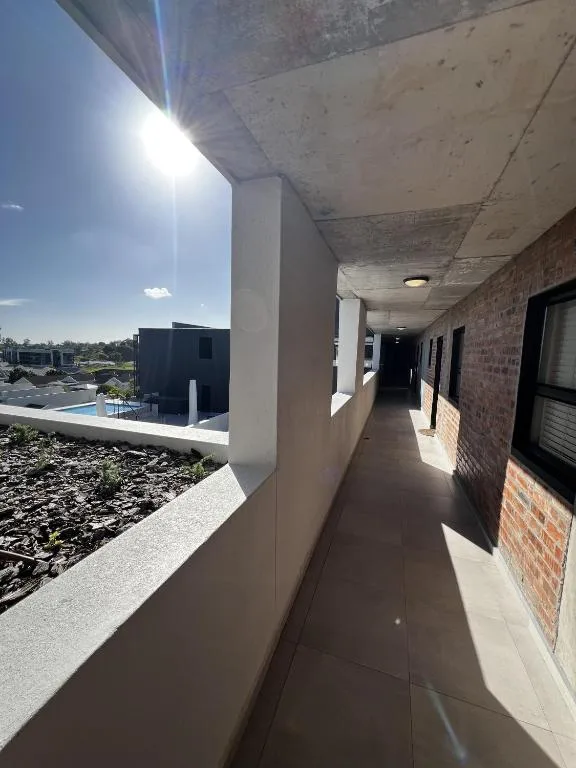 Covered balcony with mountain views and modern architectural design