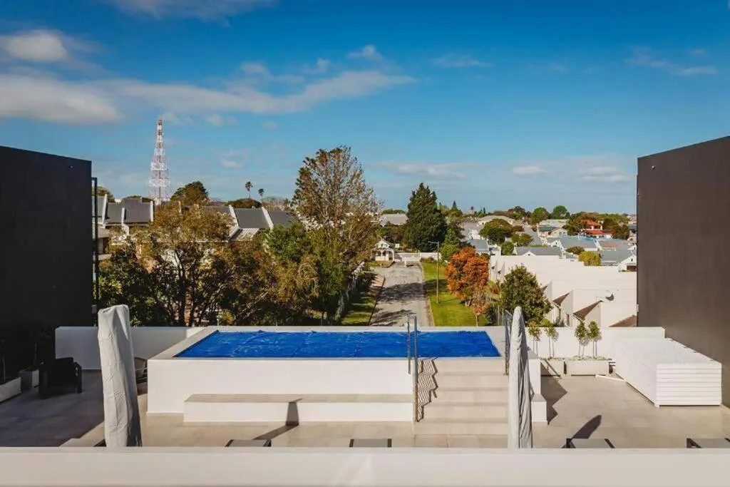 Rooftop swimming pool with blue water overlooking George town landscape