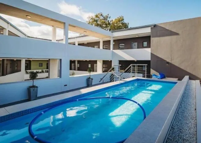Indoor swimming pool with blue water and modern architectural surroundings