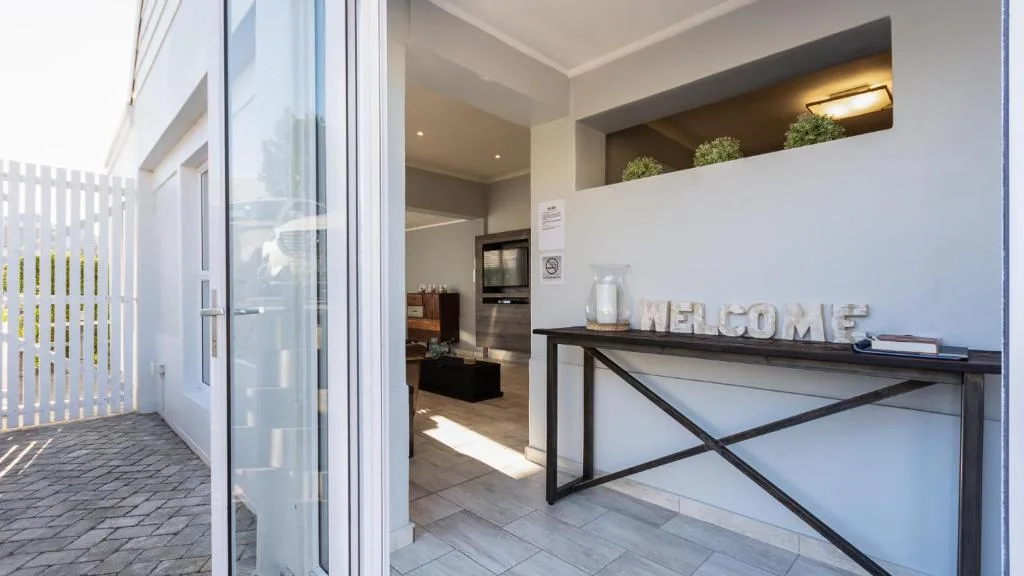 Modern entrance hallway with welcome sign and contemporary console table