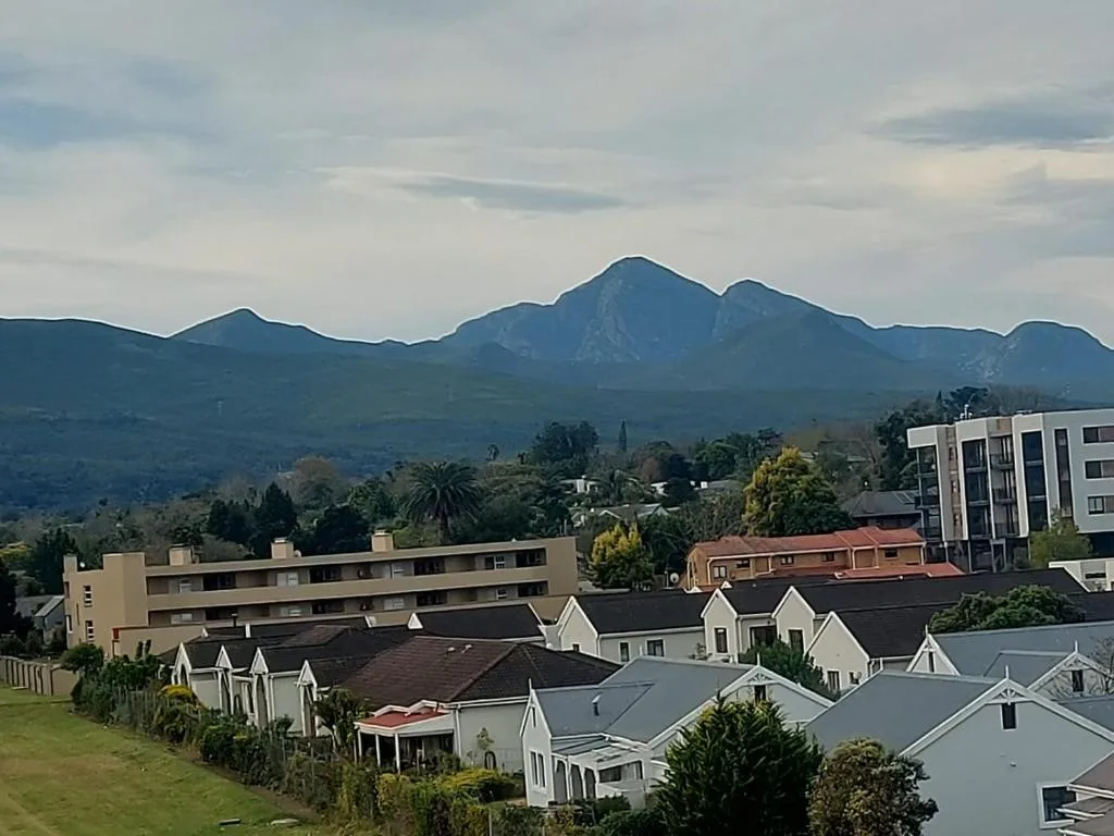 Dramatic mountain range vista overlooking George town and residential properties below