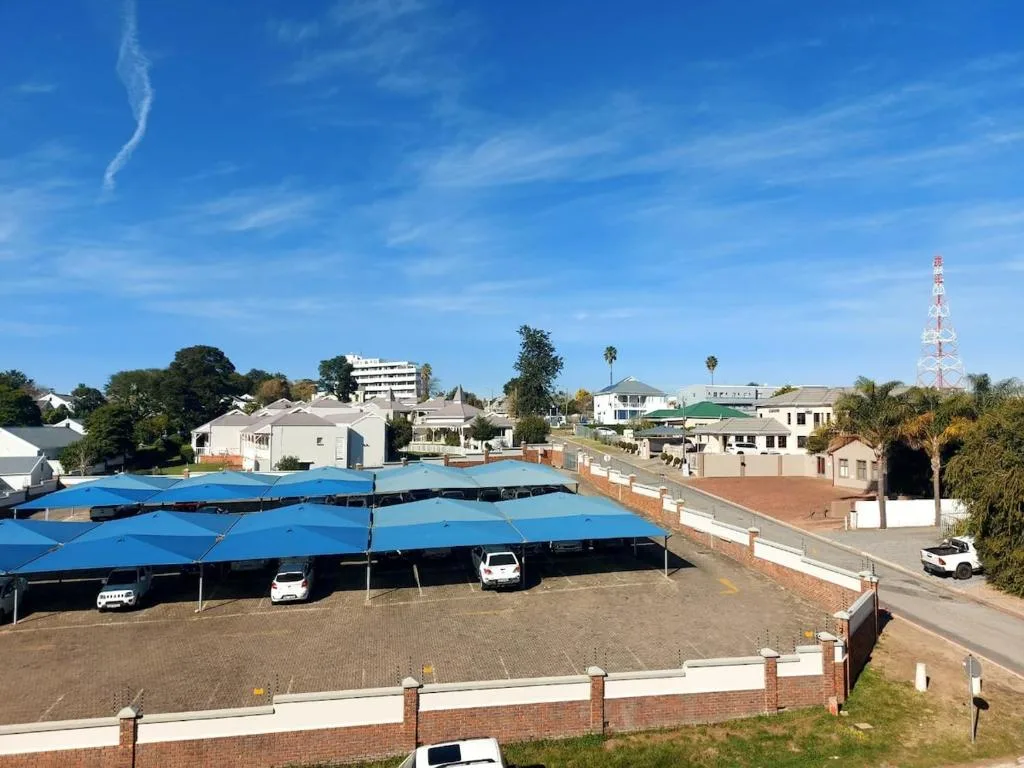Aerial view of George town with blue shade structures and residential buildings