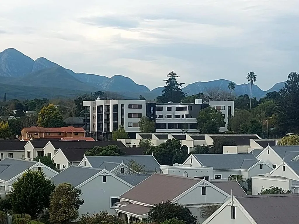 Mountain backdrop and town landscape visible from property elevation