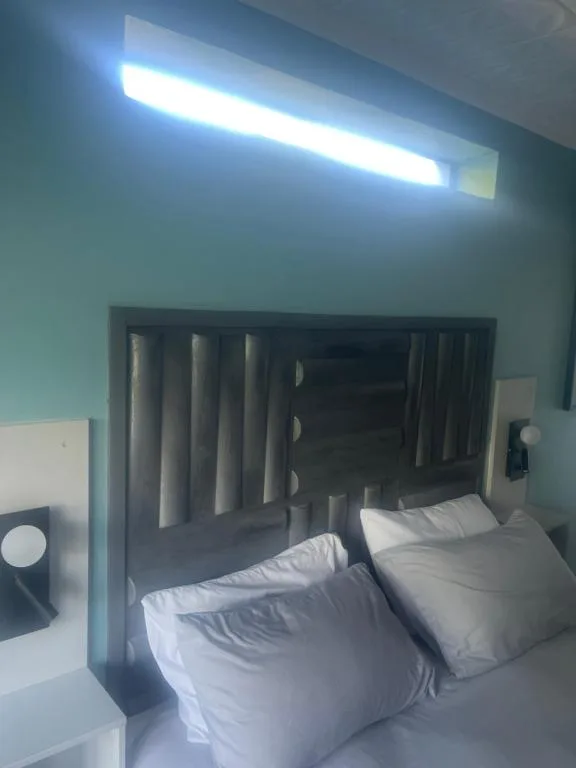 Modern bedroom with twin beds and contemporary black headboard design