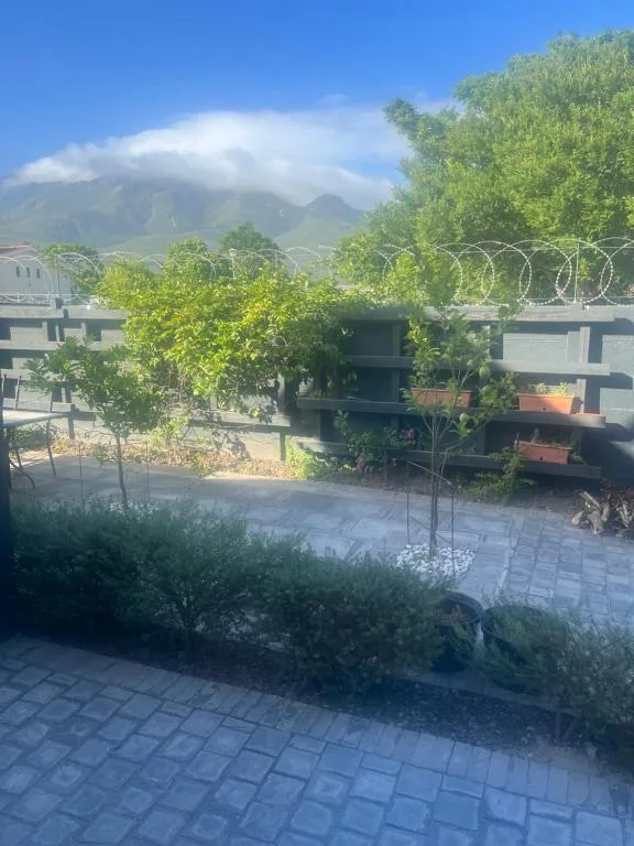 Mountain vista with lush green peaks beyond the property courtyard