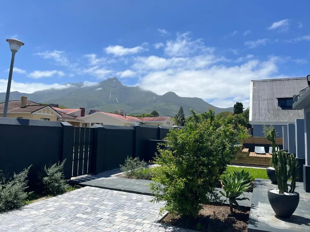 Mountain landscape visible from property courtyard with lush green surroundings