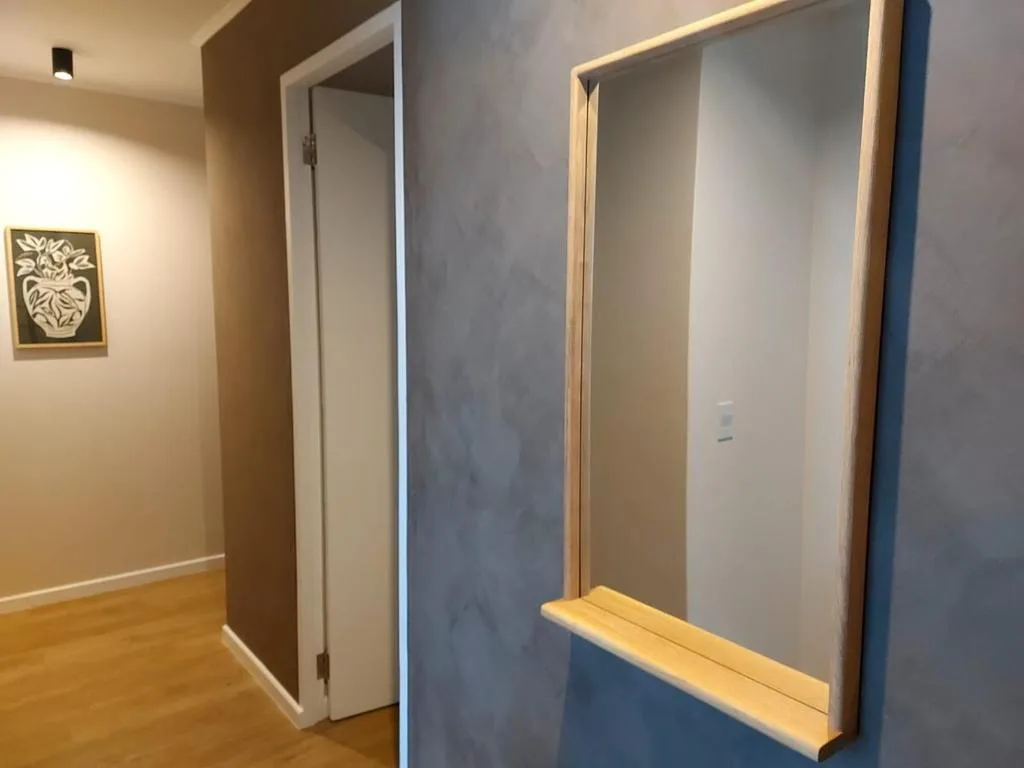 Modern bathroom with illuminated mirrors and contemporary fixtures