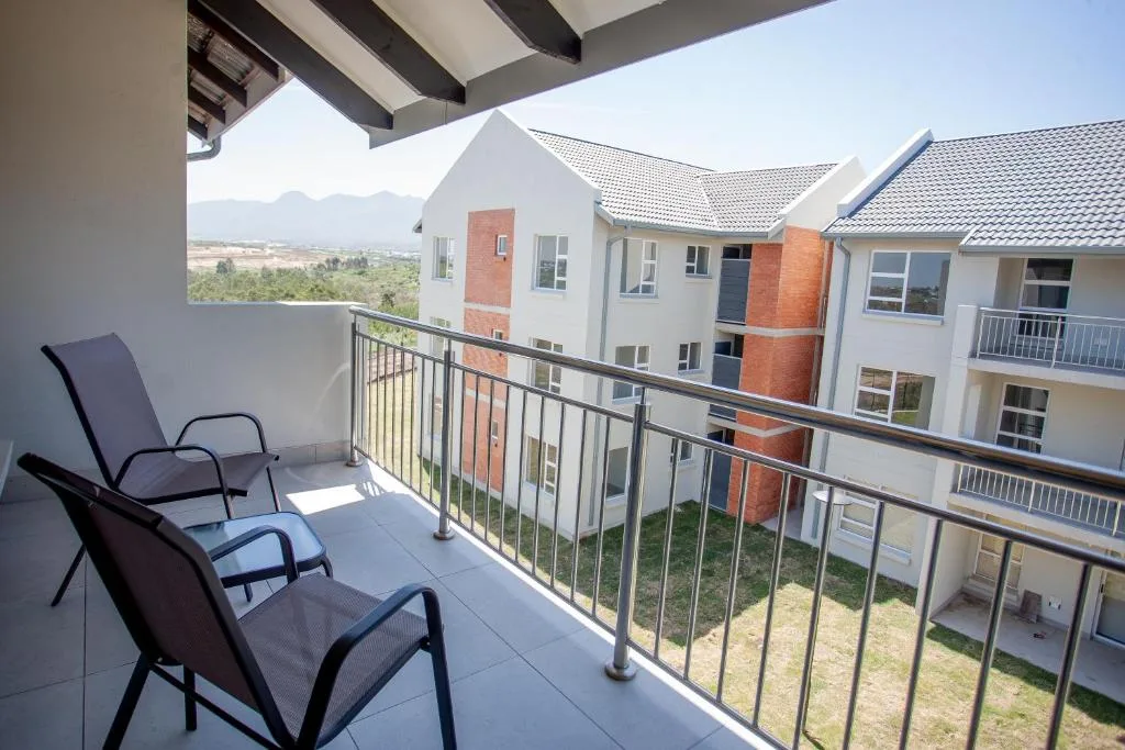 Balcony with lounge chairs overlooking mountains and valley views