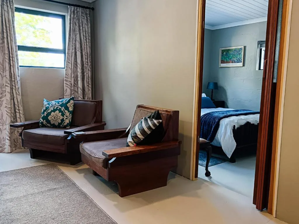 Comfortable lounge area with brown upholstered seating and natural light