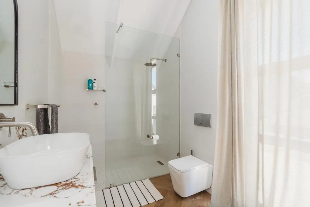 Modern bathroom with freestanding tub, walk-in shower, and contemporary finishes