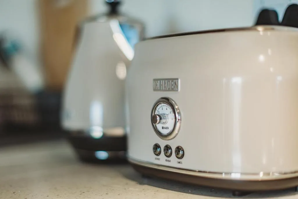 Vintage cream-colored Chaden toaster with chrome details and controls