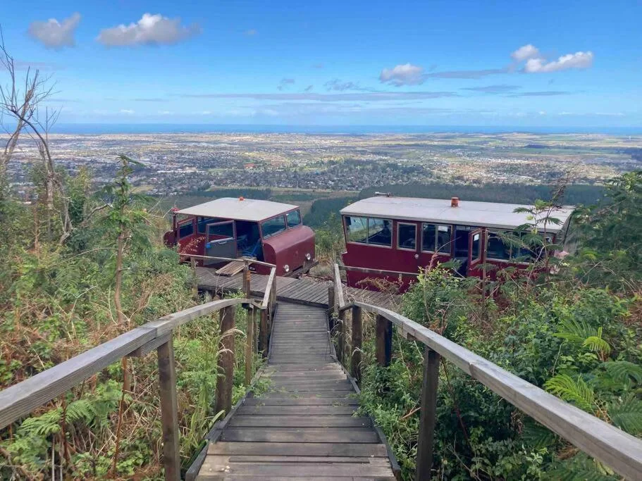 Panoramic coastal landscape view from elevated wooden deck with lagoon