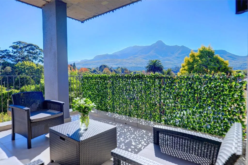 Covered patio with mountain views and comfortable outdoor seating