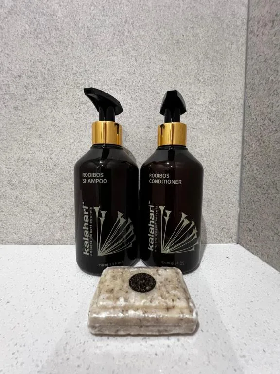 Luxury toiletries set with rooibos shampoo, conditioner, and artisanal soap