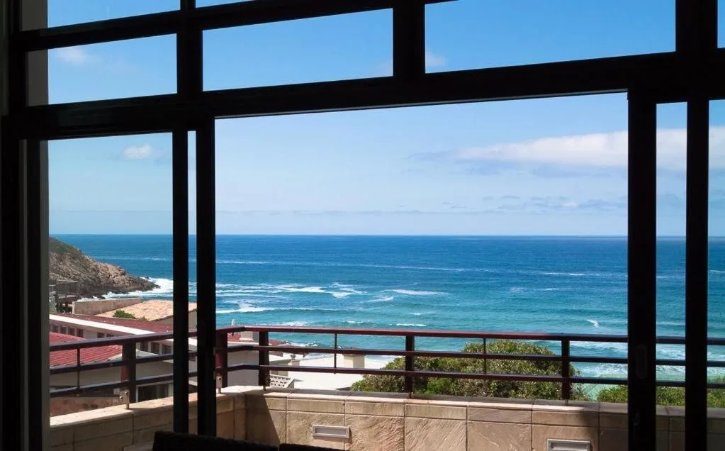 Expansive ocean view through large windows from inside property