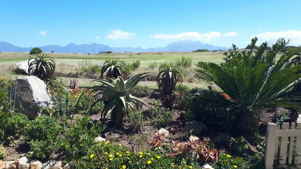 Mountains and farmland landscape visible from property garden area