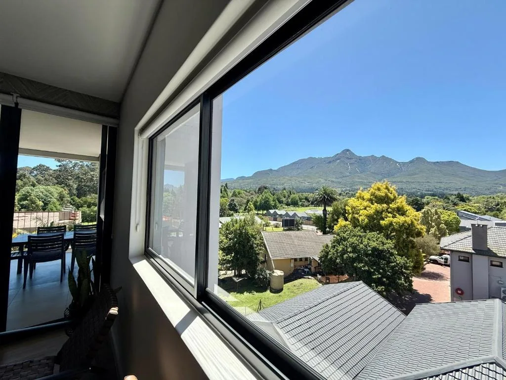 Mountain vista framed by large windows with garden route landscape
