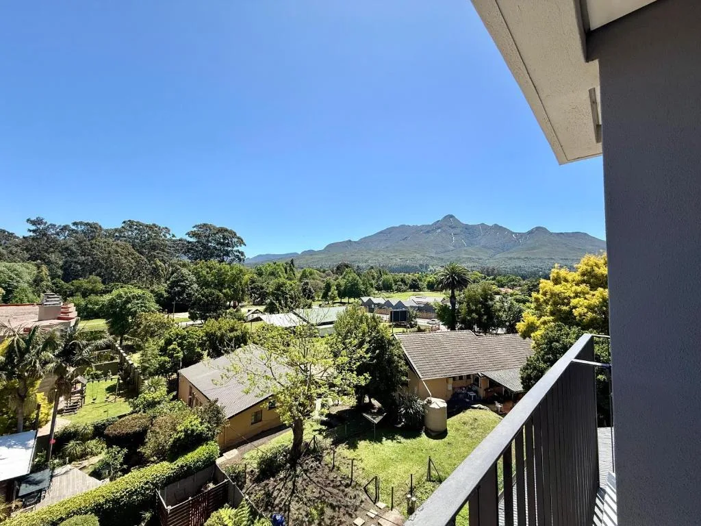 Mountain vista and lush valley landscape viewed from property balcony