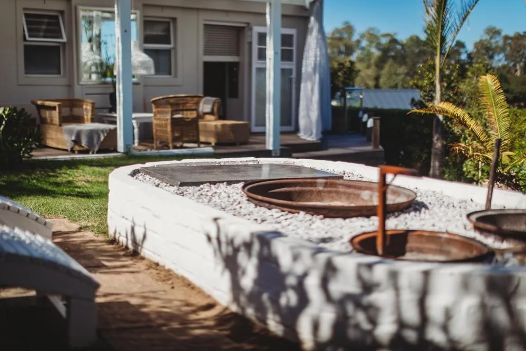 Modern outdoor seating area with fire pits and garden furniture