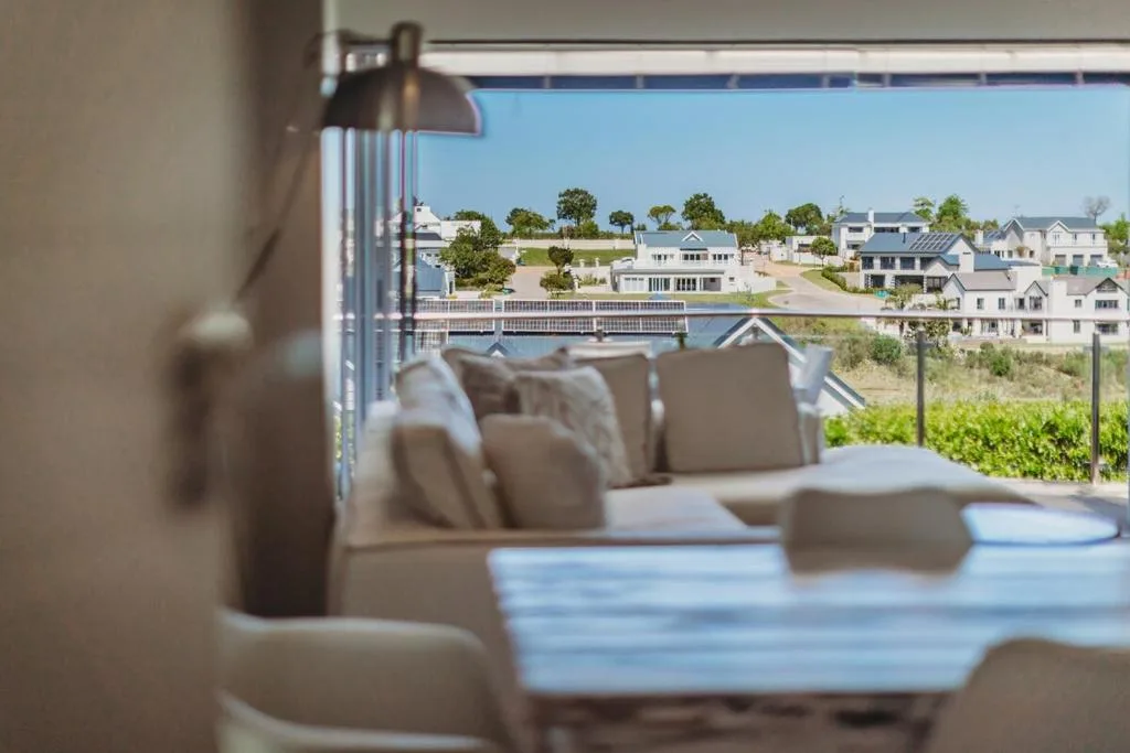 Scenic lagoon and residential neighborhood views from modern interior seating area