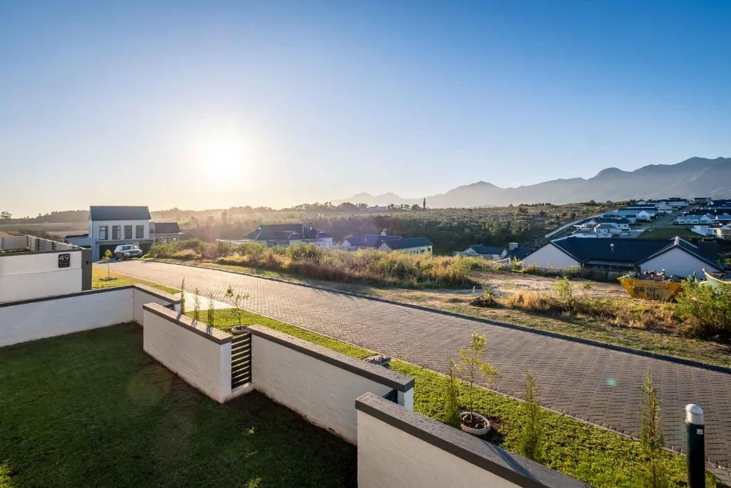Mountain and valley vista at sunrise from property overlooking Garden Route landscape