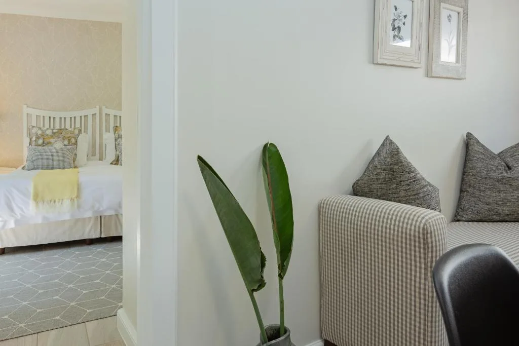 Modern interior detail with potted plant and neutral décor accents