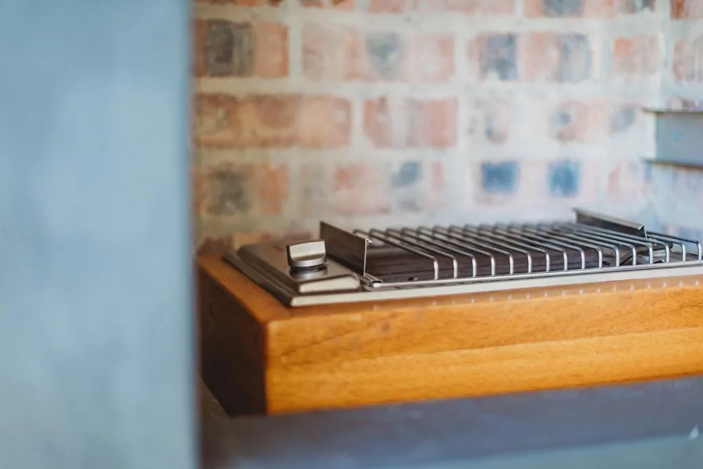 Vintage keyboard instrument displayed on wooden furniture indoors